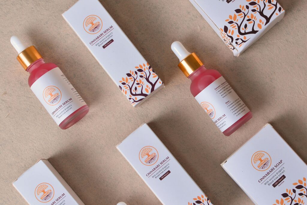 Flat lay of cosmetic serum bottles and boxes for beauty and skincare.