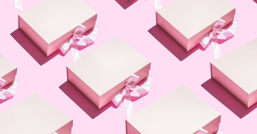 Aesthetic pink gift boxes with ribbons in a seamless pattern on a pink background.