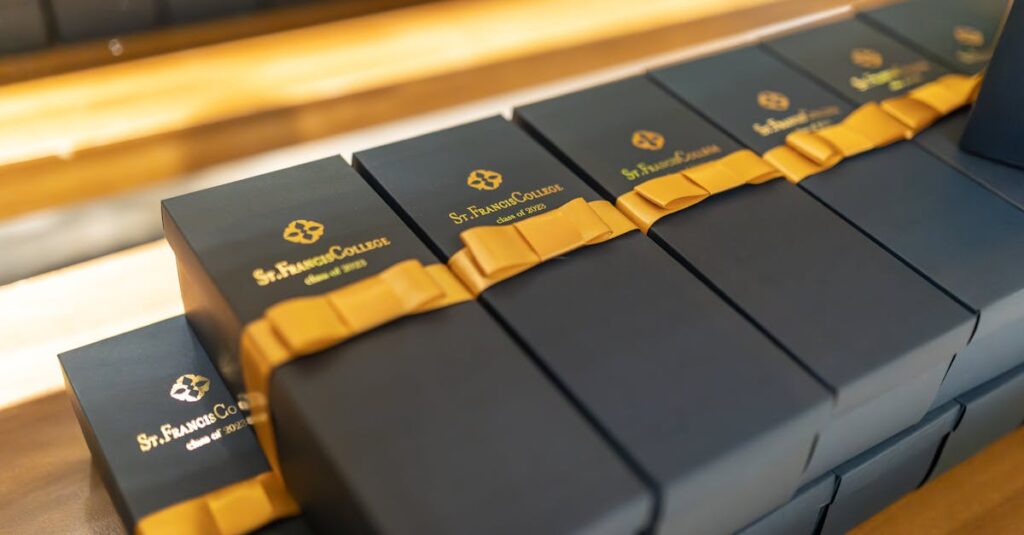 Elegant black gift boxes with golden bows from St. Francis College.