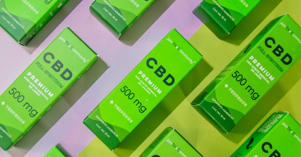 Array of CBD product boxes displayed on a vibrant colored surface. Ideal for retail and product design themes.
