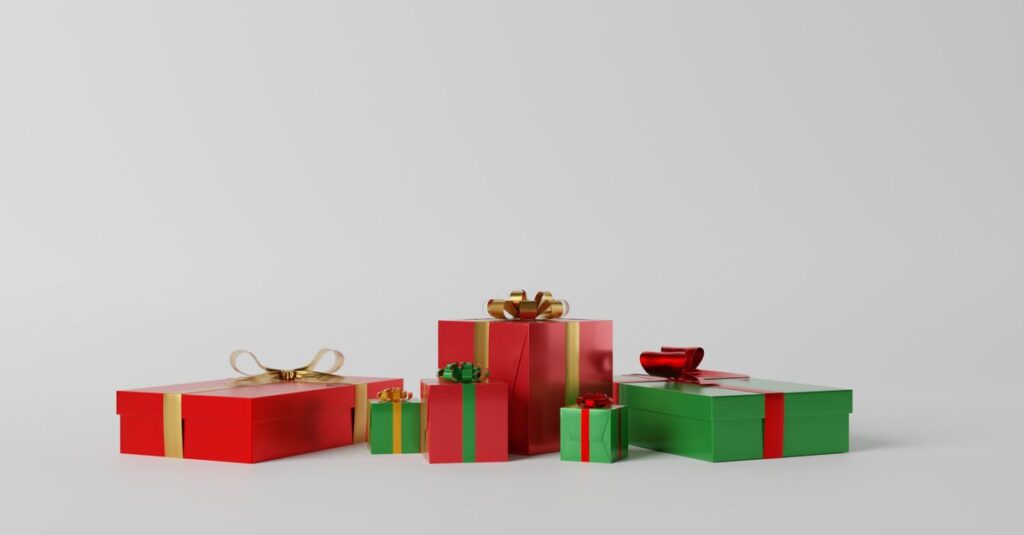 A variety of red and green gift boxes with ribbons on a white background, perfect for celebrations.