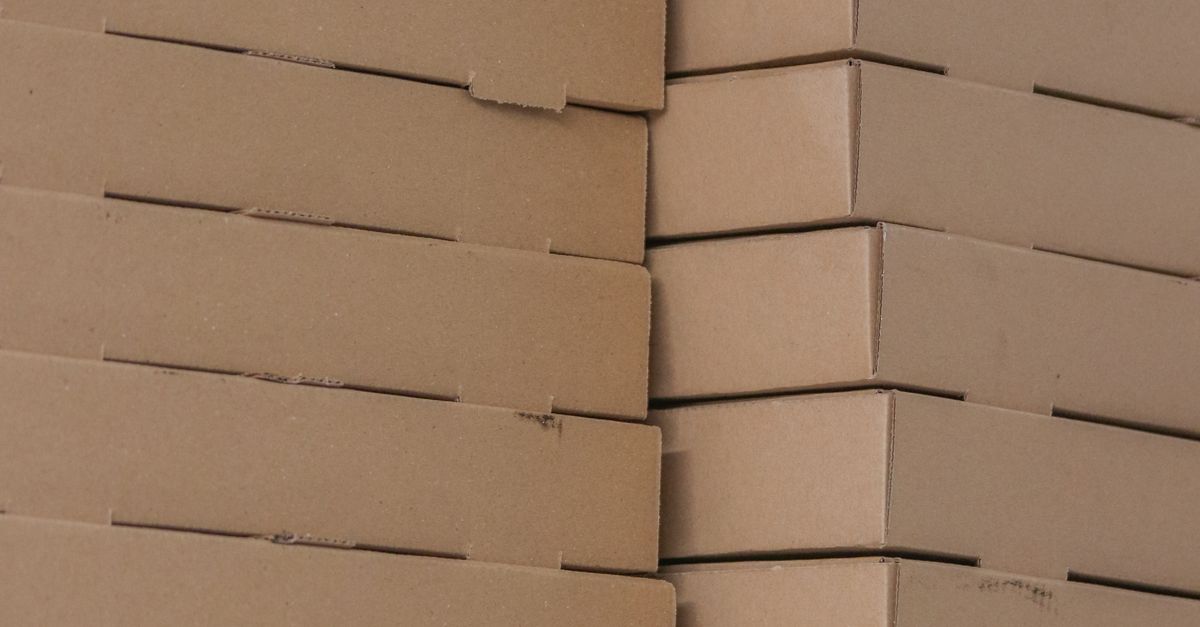 Detail shot of stacked brown cardboard boxes showing texture and symmetry.
