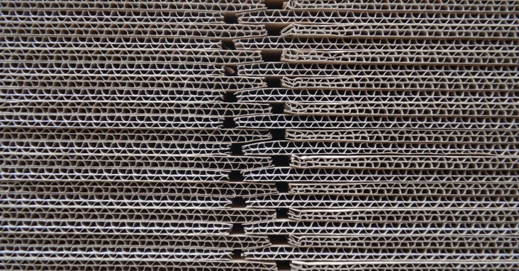 Detailed close-up of corrugated cardboard stack showcasing its wavy texture and pattern.