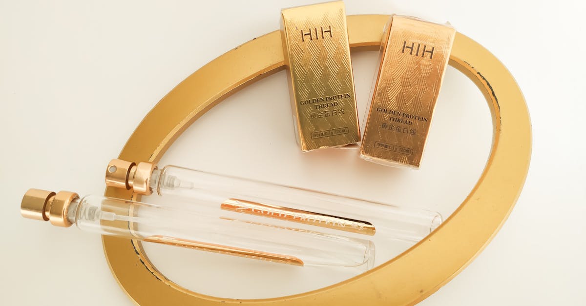 Luxurious perfume bottles with elegant gold packaging captured on a flat lay setup.