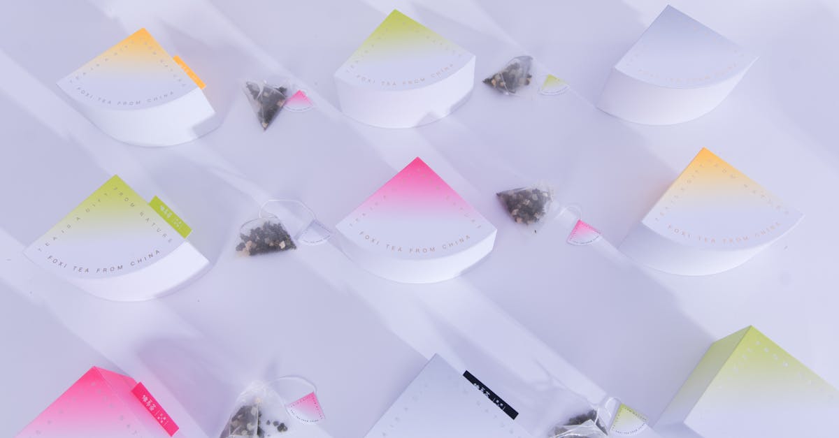 Creative flat lay of colorful tea packaging with teabags. Ideal for lifestyle and product presentations.