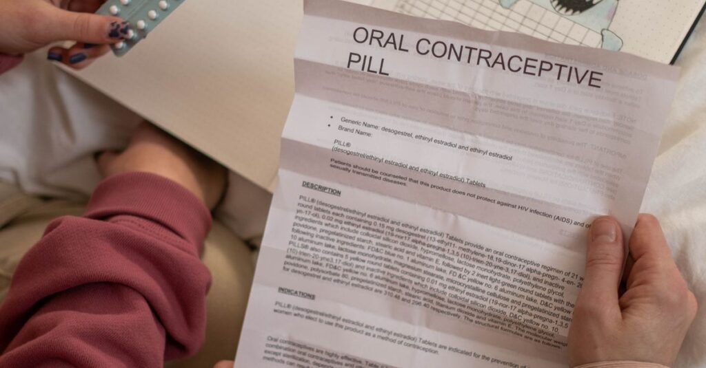 Individuals reviewing oral contraceptive pills and period tracker together, symbolizing informed healthcare decisions.