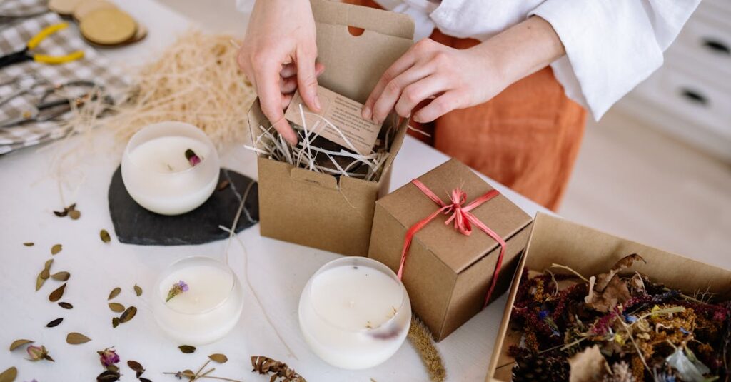 Person assembling eco-friendly candle gift boxes with natural materials.
