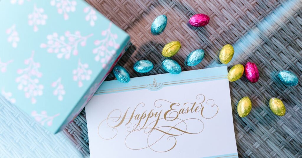 Easter card with colorful foil-wrapped chocolate eggs on a wicker surface.