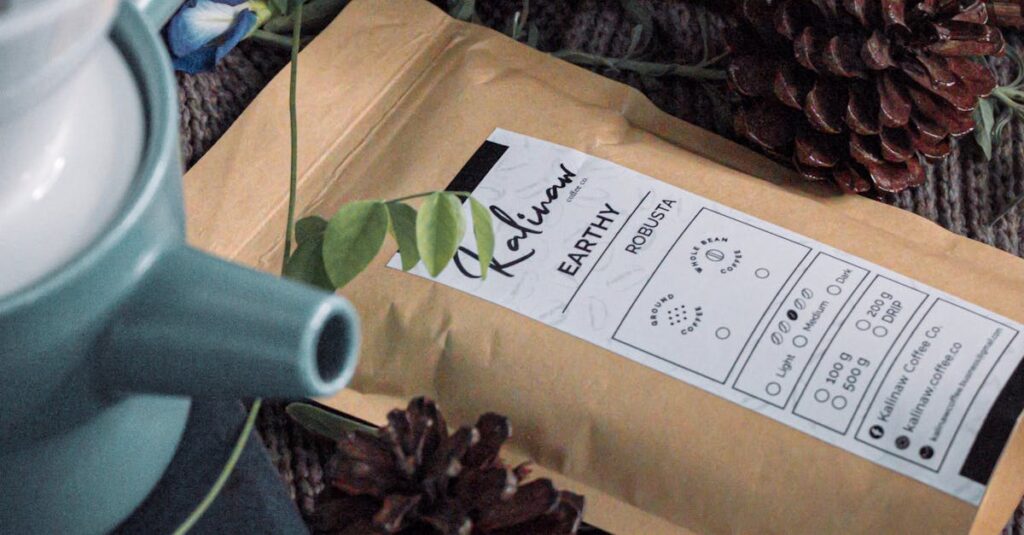 A rustic scene featuring coffee packaging surrounded by pine cones and a teal teapot.