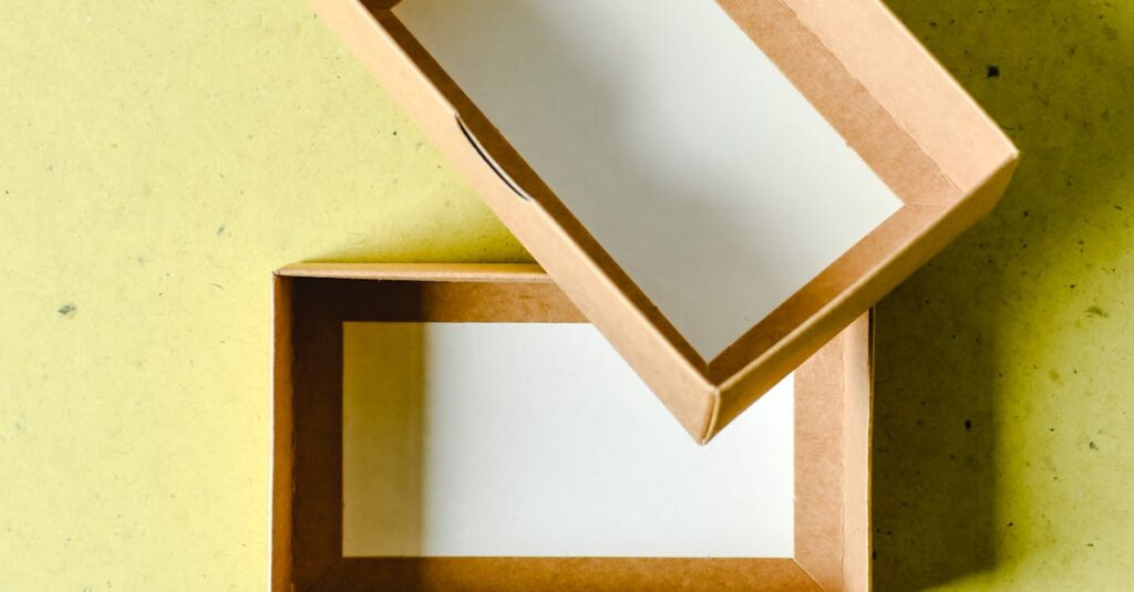 Two empty cardboard boxes placed diagonally on a yellow background, ideal for mock-ups or packaging concepts.