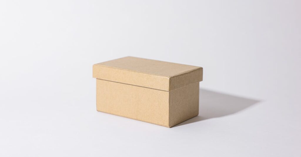 Close-up of a simple kraft box against a plain background, highlighting minimalist design.