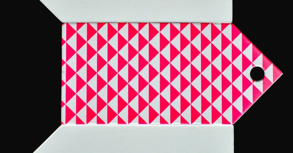 Three tags with geometric designs on a dark background, ideal for branding or crafts.