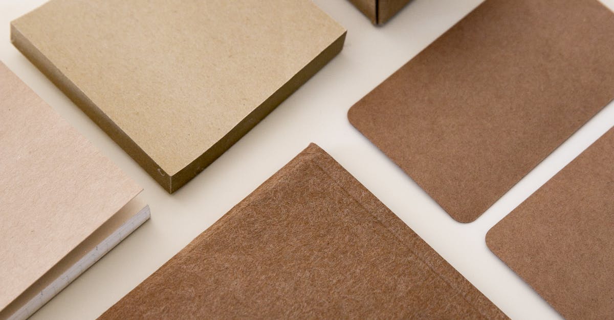 Geometric arrangement of kraft paper stationery products showcased in a minimalist style.