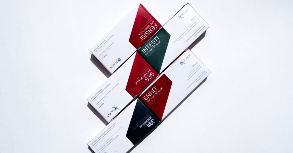 Close-up of various pharmaceutical packages arranged on a white surface.