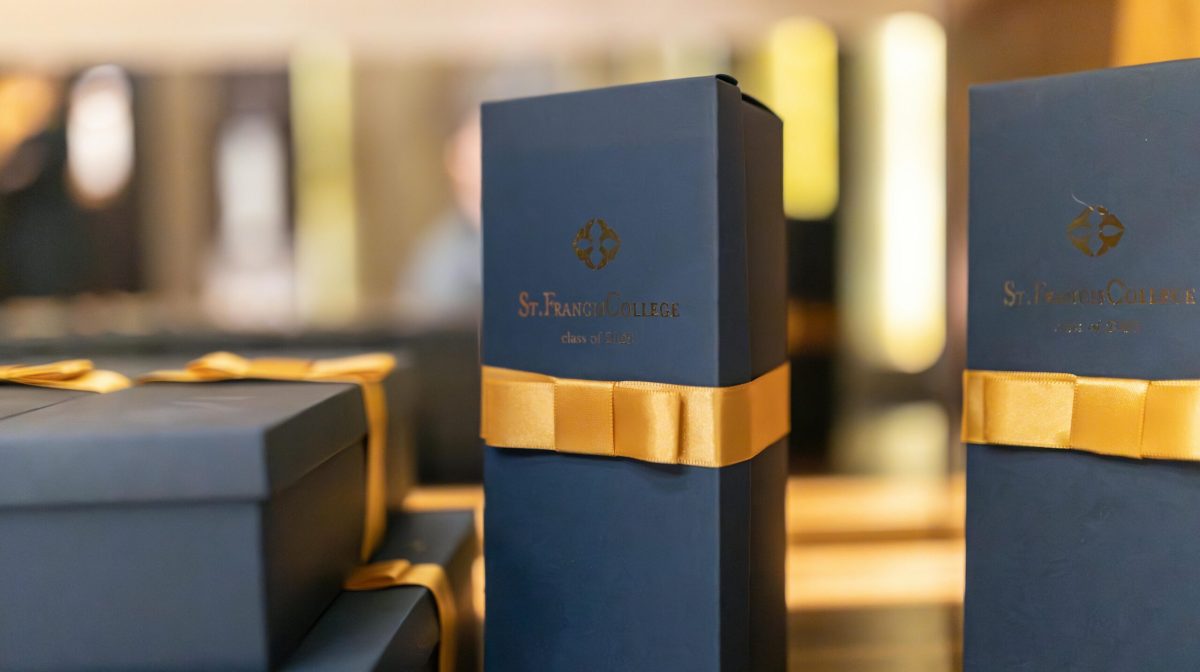 Sophisticated gift boxes with yellow ribbons promoting luxury merchandise.